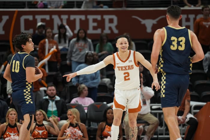 Texas Longhorns guard Chendall Weaver (2) points to who he is guarding during a scrimmage against St. Edward's University on Monday, Oct. 30, 2023